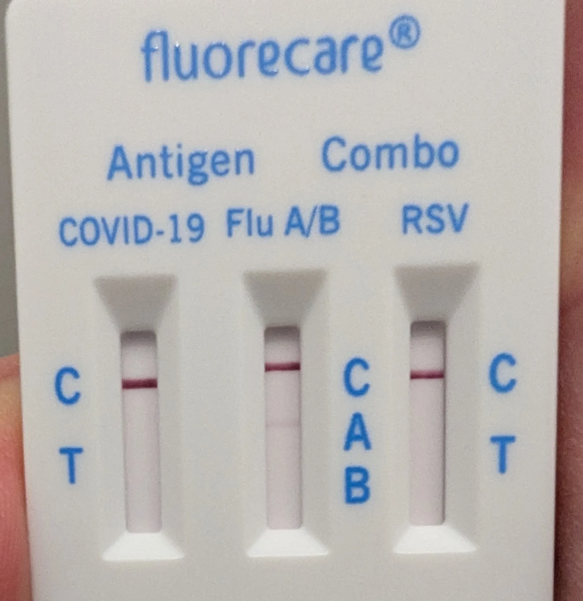 A rapid test for Influenza, RSV and COVID-19 showing a weak line under Influenza-A
